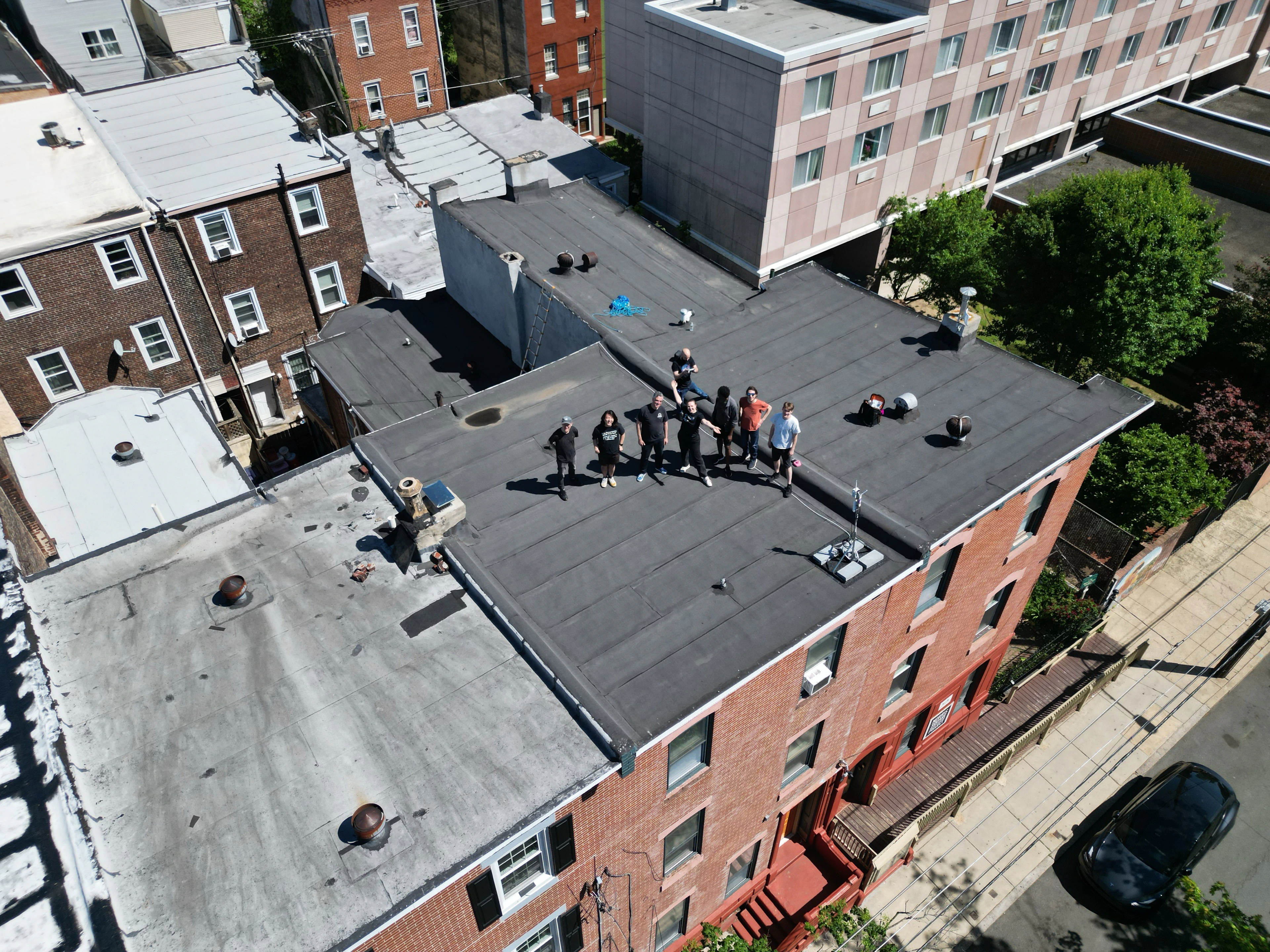 PCW Volunteers posing for a group photo on the roof of NSNP.